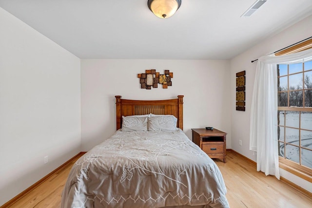 bedroom with light hardwood / wood-style flooring