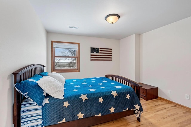 bedroom featuring light hardwood / wood-style flooring