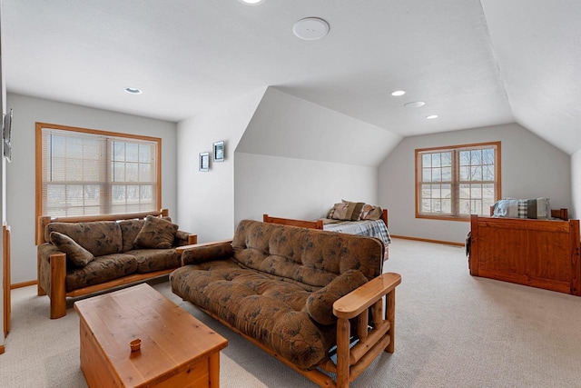 bedroom featuring lofted ceiling and light colored carpet