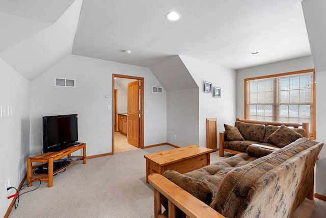 carpeted living room featuring lofted ceiling