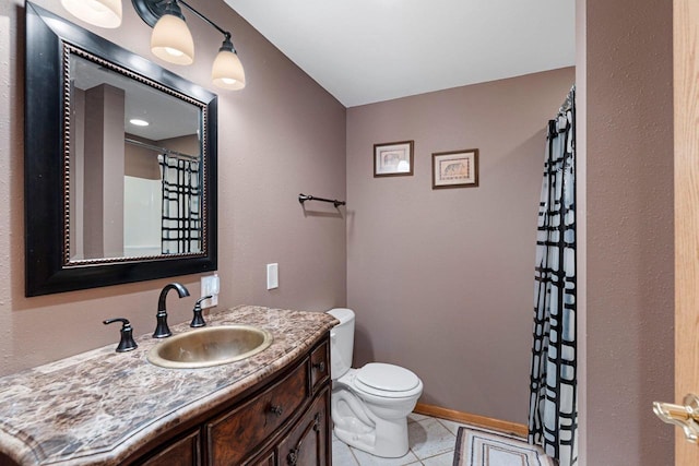 bathroom with toilet, vanity, tile patterned flooring, and curtained shower