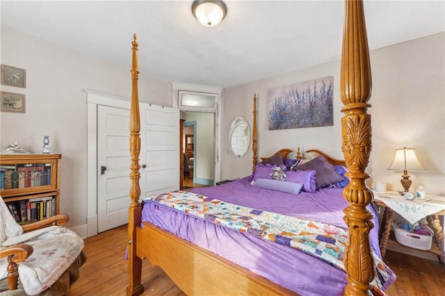 bedroom with hardwood / wood-style flooring