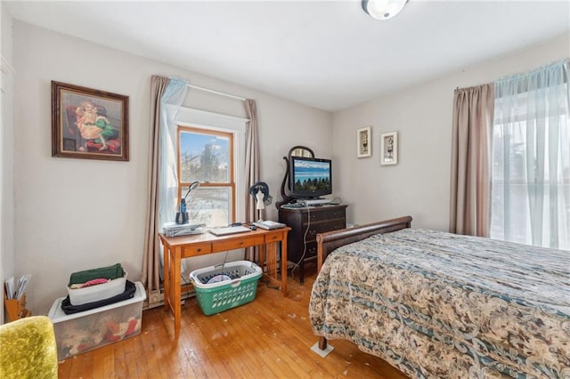 bedroom with hardwood / wood-style flooring