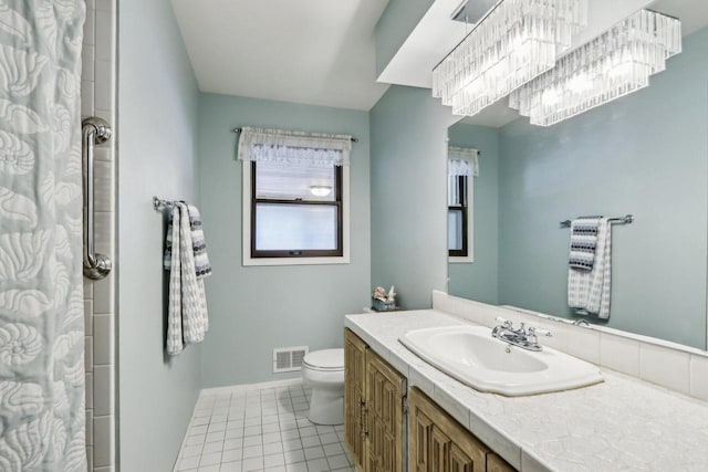 bathroom featuring a shower with curtain, tile patterned floors, vanity, and toilet