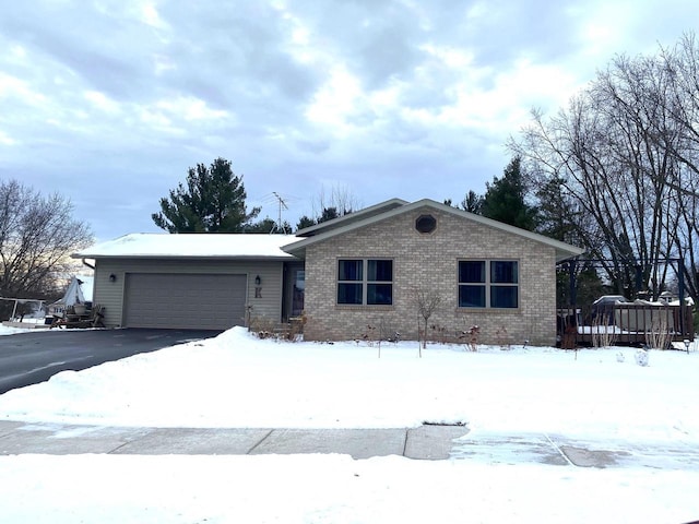 single story home featuring a garage