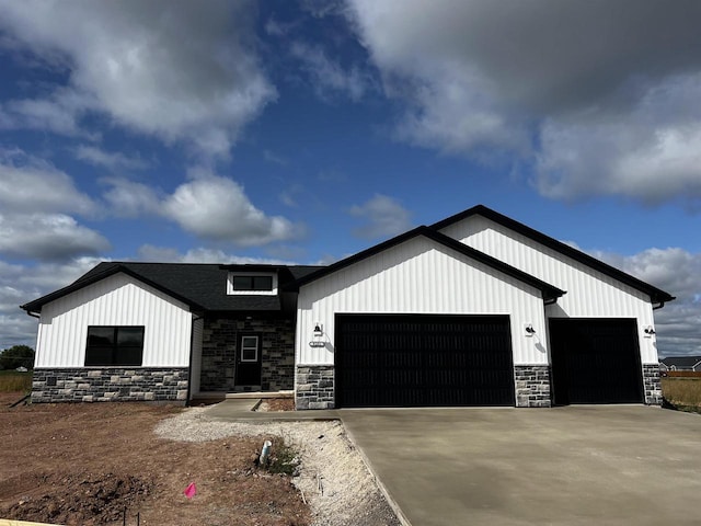 modern inspired farmhouse with a garage