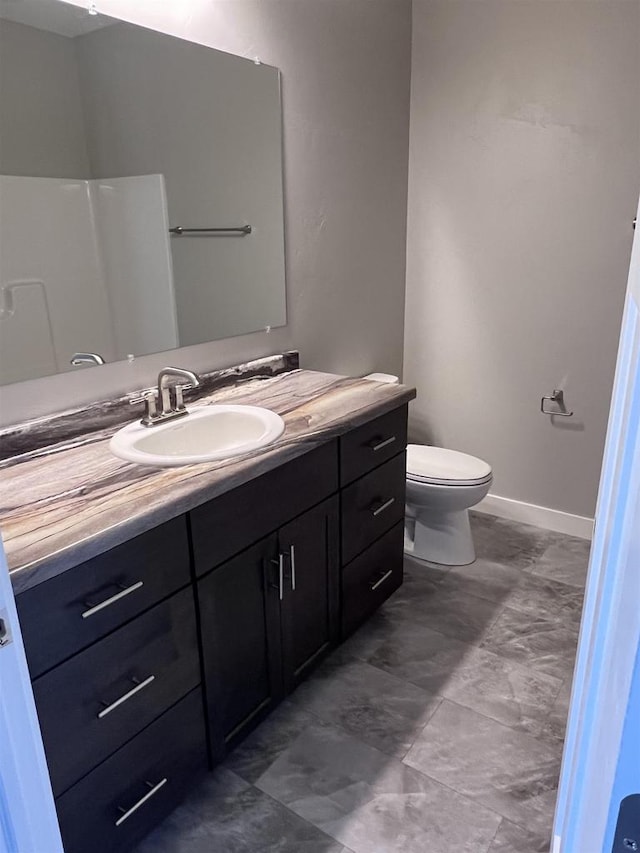 bathroom with toilet and vanity