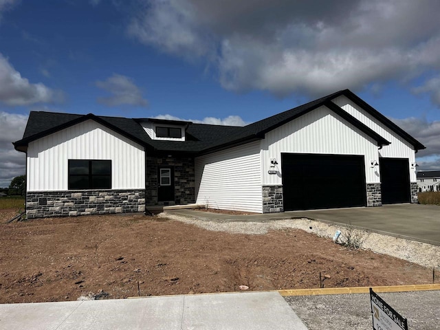 modern inspired farmhouse with a garage