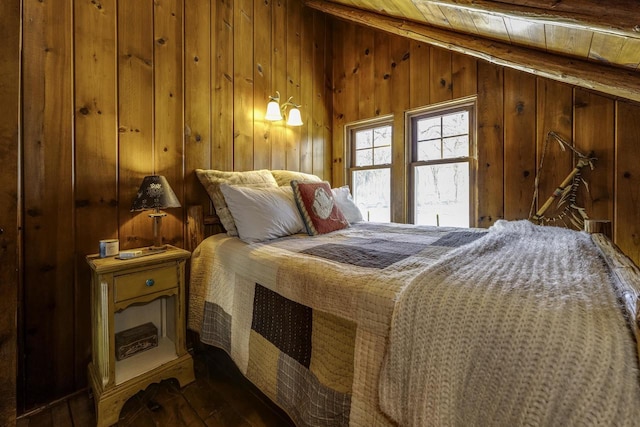 bedroom featuring wood-type flooring, lofted ceiling, wooden ceiling, and wood walls