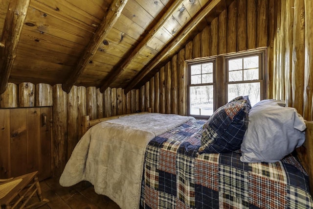 bedroom with vaulted ceiling with beams, wood ceiling, and wood walls