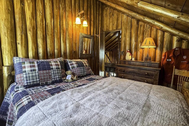 bedroom with wood walls