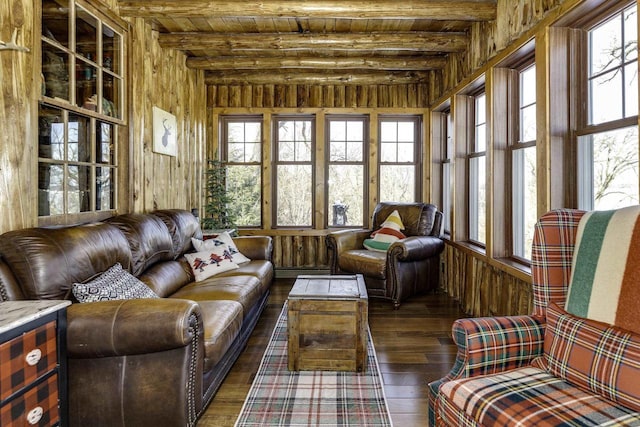 sunroom with beam ceiling, plenty of natural light, and wooden ceiling