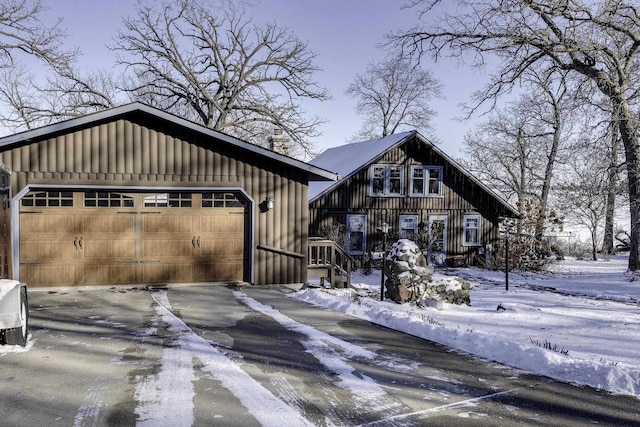 view of front of property featuring an outbuilding and a garage