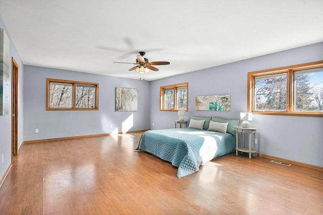 bedroom featuring ceiling fan and light hardwood / wood-style flooring