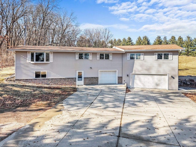 rear view of house featuring a garage