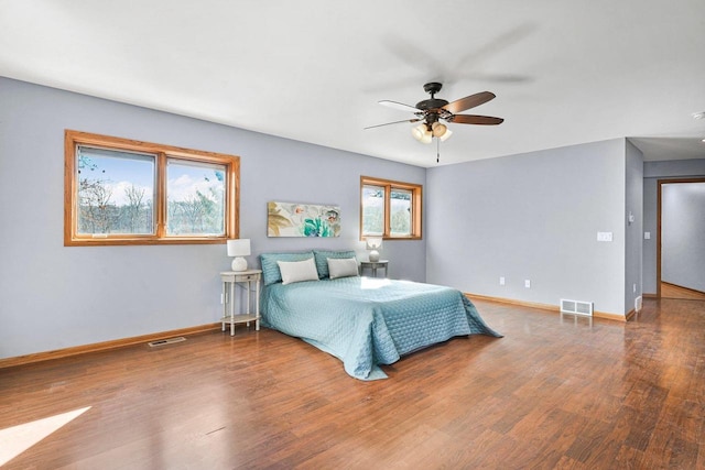 bedroom with hardwood / wood-style floors and ceiling fan