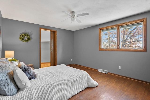 bedroom featuring hardwood / wood-style flooring and ceiling fan