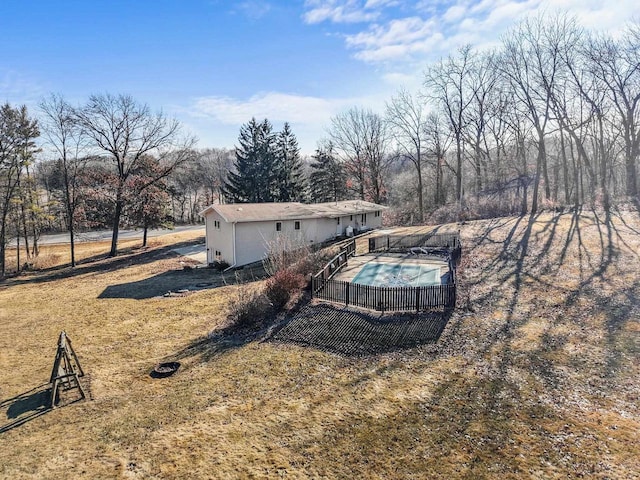 view of yard with a fenced in pool