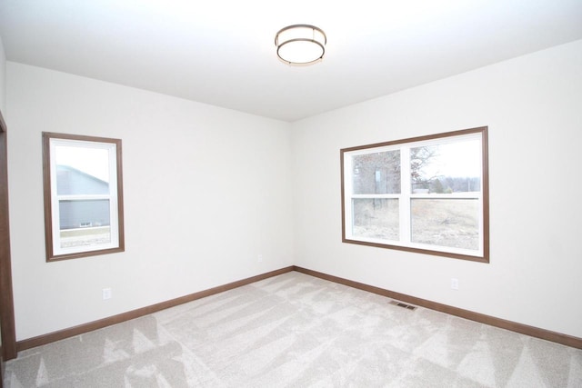 empty room featuring light colored carpet