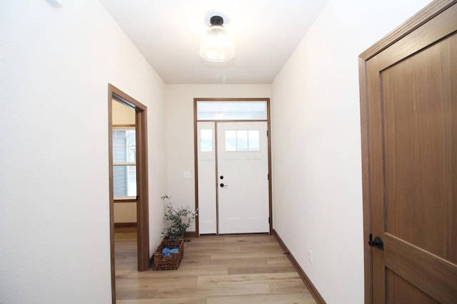 doorway with light hardwood / wood-style flooring