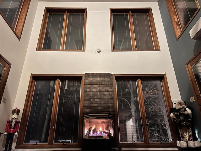 doorway to property featuring a brick fireplace