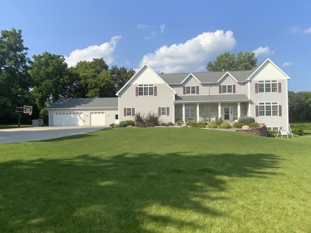 view of front of home featuring a front yard, a garage, and a porch