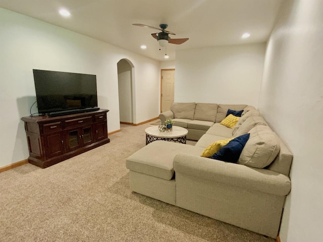 living room featuring ceiling fan and light colored carpet