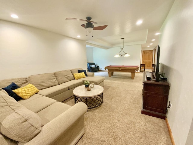 carpeted living room featuring ceiling fan, a raised ceiling, and billiards