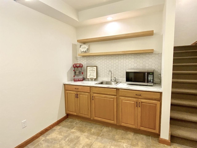 kitchen with backsplash and sink