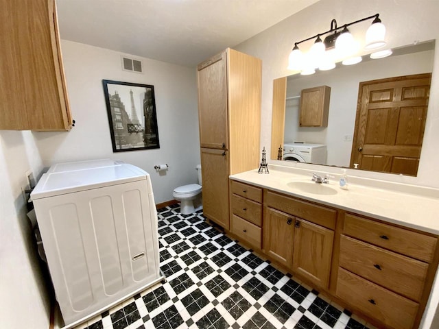 bathroom with toilet and vanity