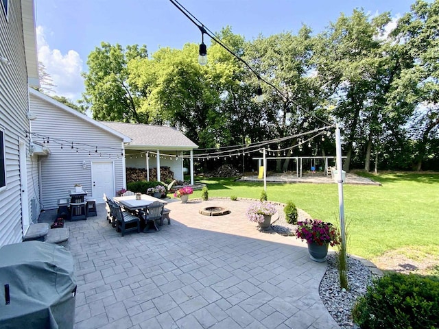 view of patio / terrace with area for grilling and an outdoor fire pit