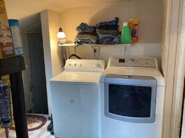 laundry area with washing machine and clothes dryer