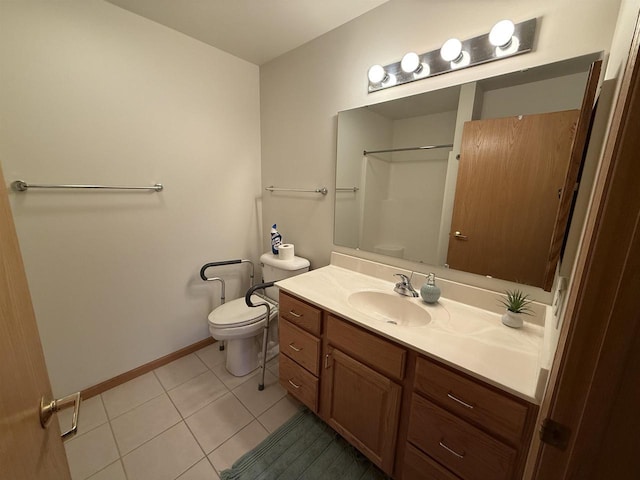 bathroom with toilet, vanity, tile patterned flooring, and walk in shower