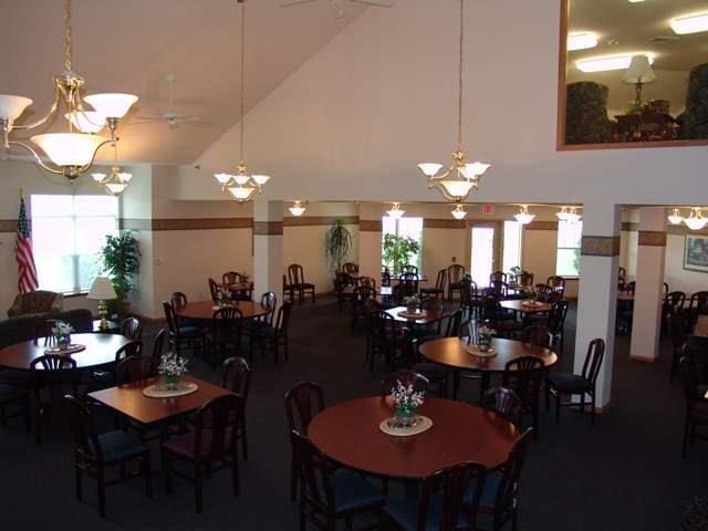 dining room with high vaulted ceiling