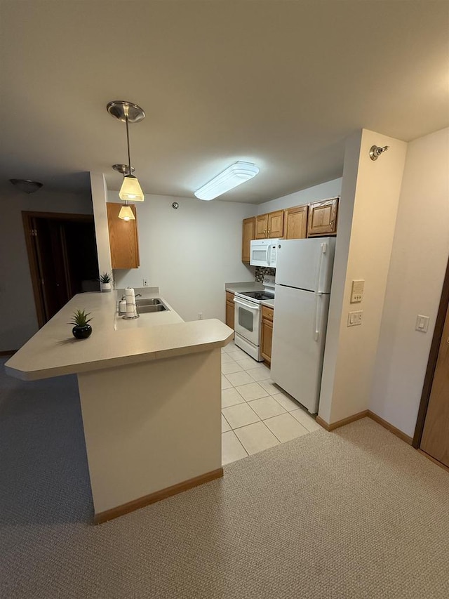 kitchen with light colored carpet, kitchen peninsula, sink, white appliances, and hanging light fixtures