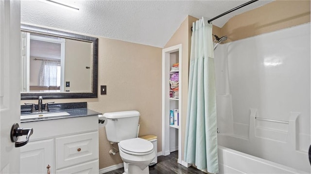 full bathroom featuring toilet, lofted ceiling, shower / tub combo, a textured ceiling, and vanity