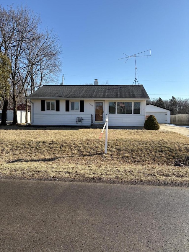 ranch-style home with a front lawn