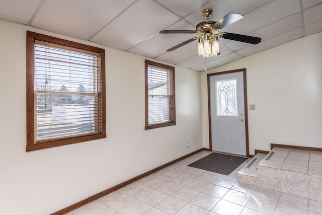 foyer with ceiling fan and lofted ceiling