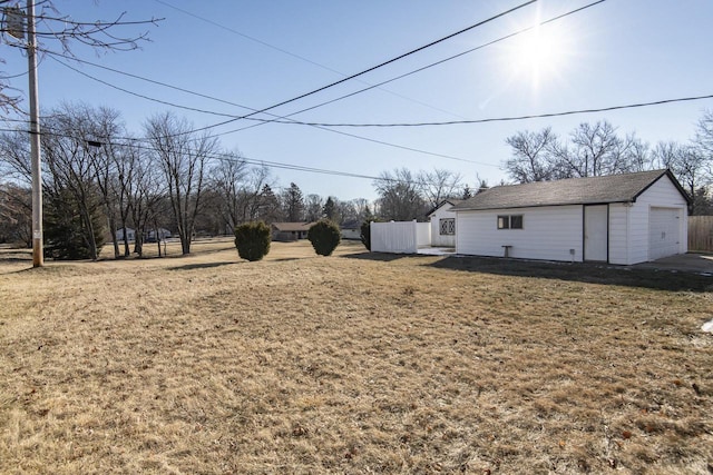 view of yard with an outdoor structure and a garage