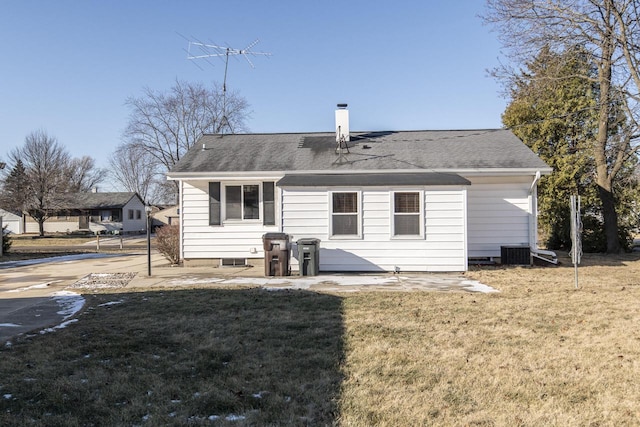 back of house featuring central air condition unit, a yard, and a patio