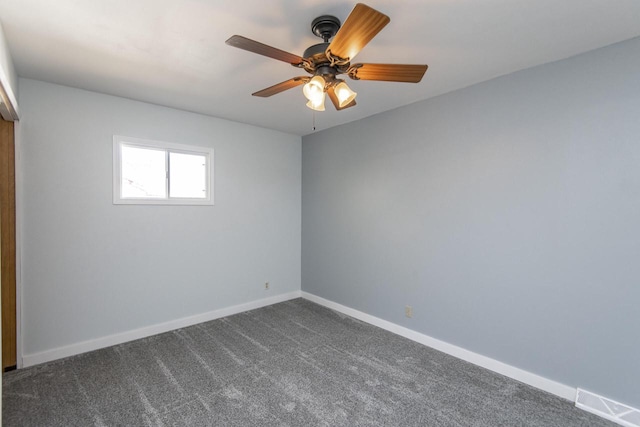 unfurnished room featuring ceiling fan and carpet flooring