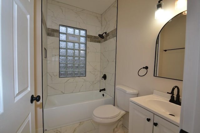 full bathroom featuring toilet, vanity, and tiled shower / bath