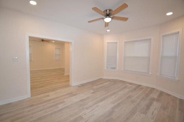 unfurnished room featuring ceiling fan and light hardwood / wood-style flooring