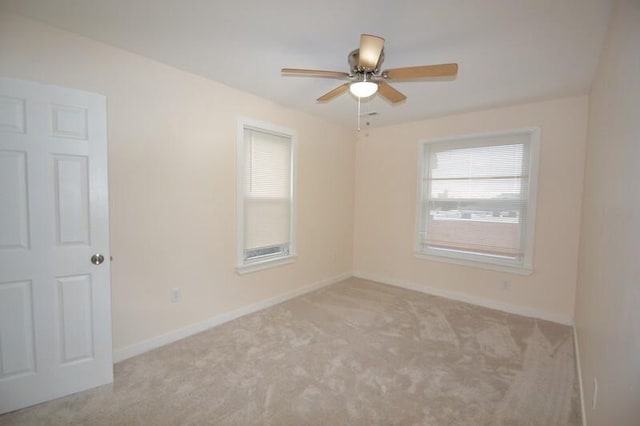 carpeted empty room with ceiling fan