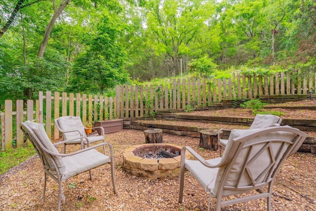 view of patio with a fire pit