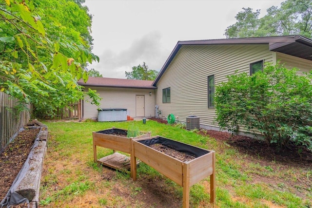 view of yard with central AC