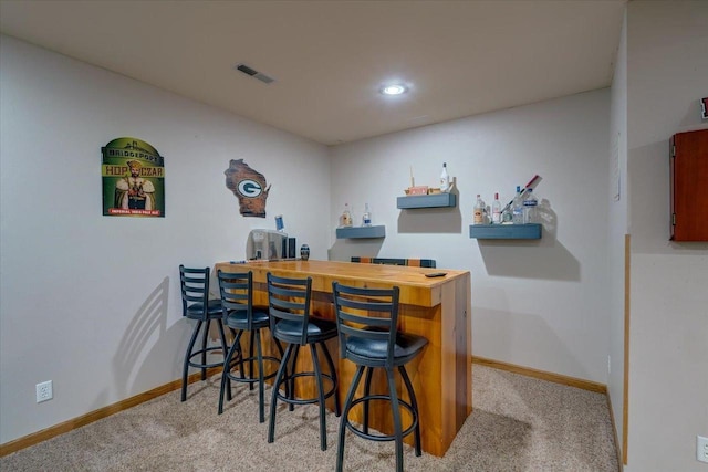 bar featuring light colored carpet