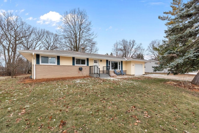 ranch-style house with a garage and a front lawn