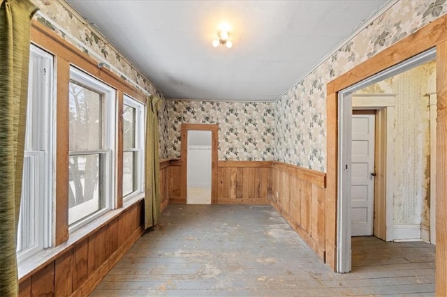 spare room with plenty of natural light and light wood-type flooring