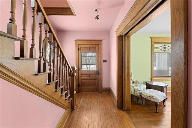 entrance foyer with plenty of natural light and hardwood / wood-style flooring